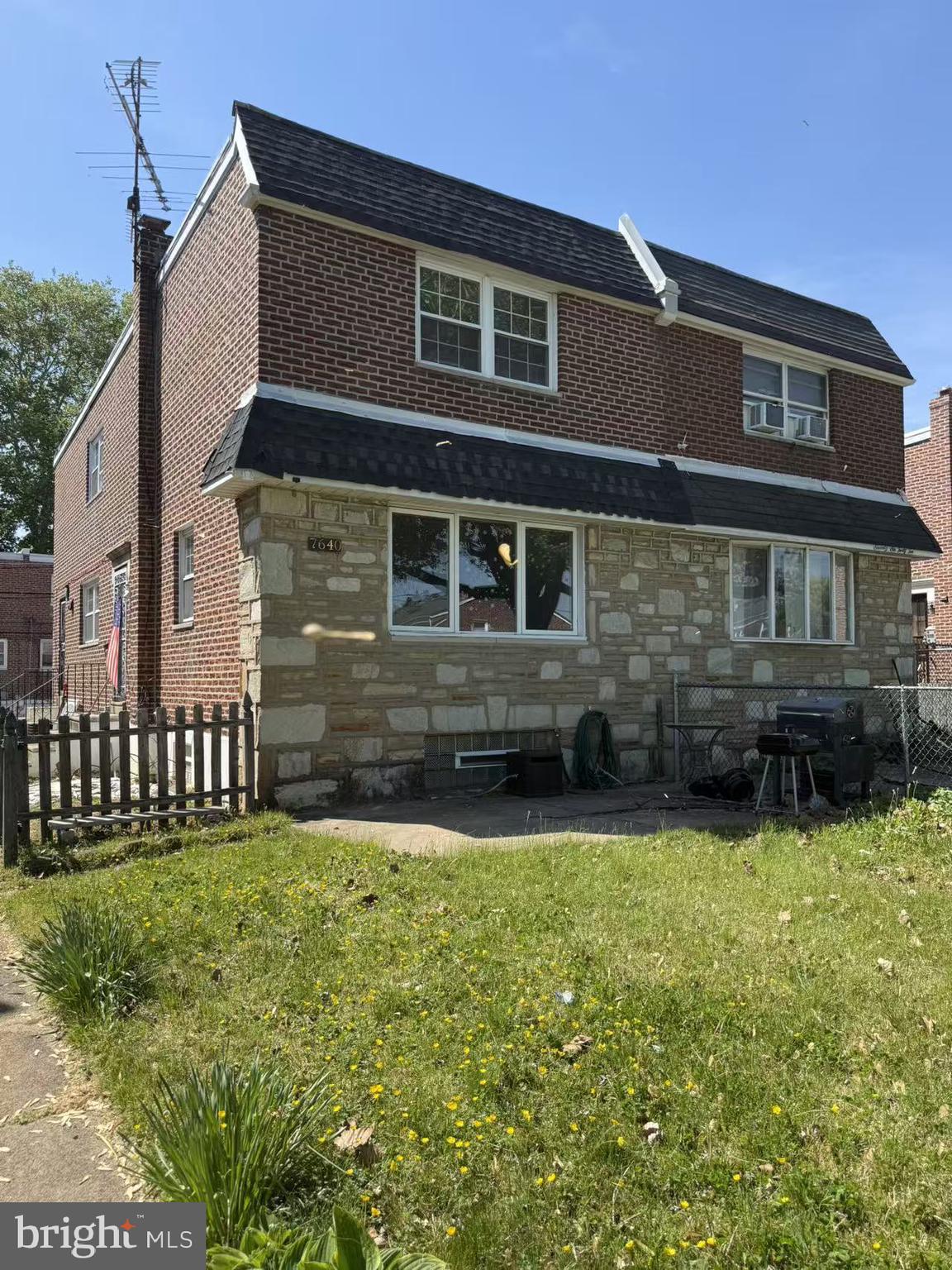 7640 Fairfield Street Philadelphia, PA 19152 - Photo 2 of 24 a front view of a house with a yard