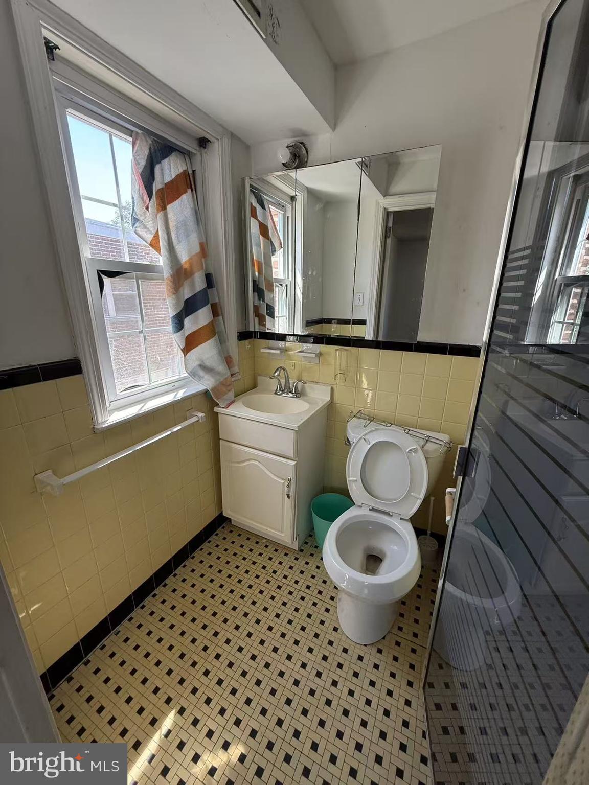 7640 Fairfield Street Philadelphia, PA 19152 - Photo 21 of 24 a bathroom with a sink toilet and a window