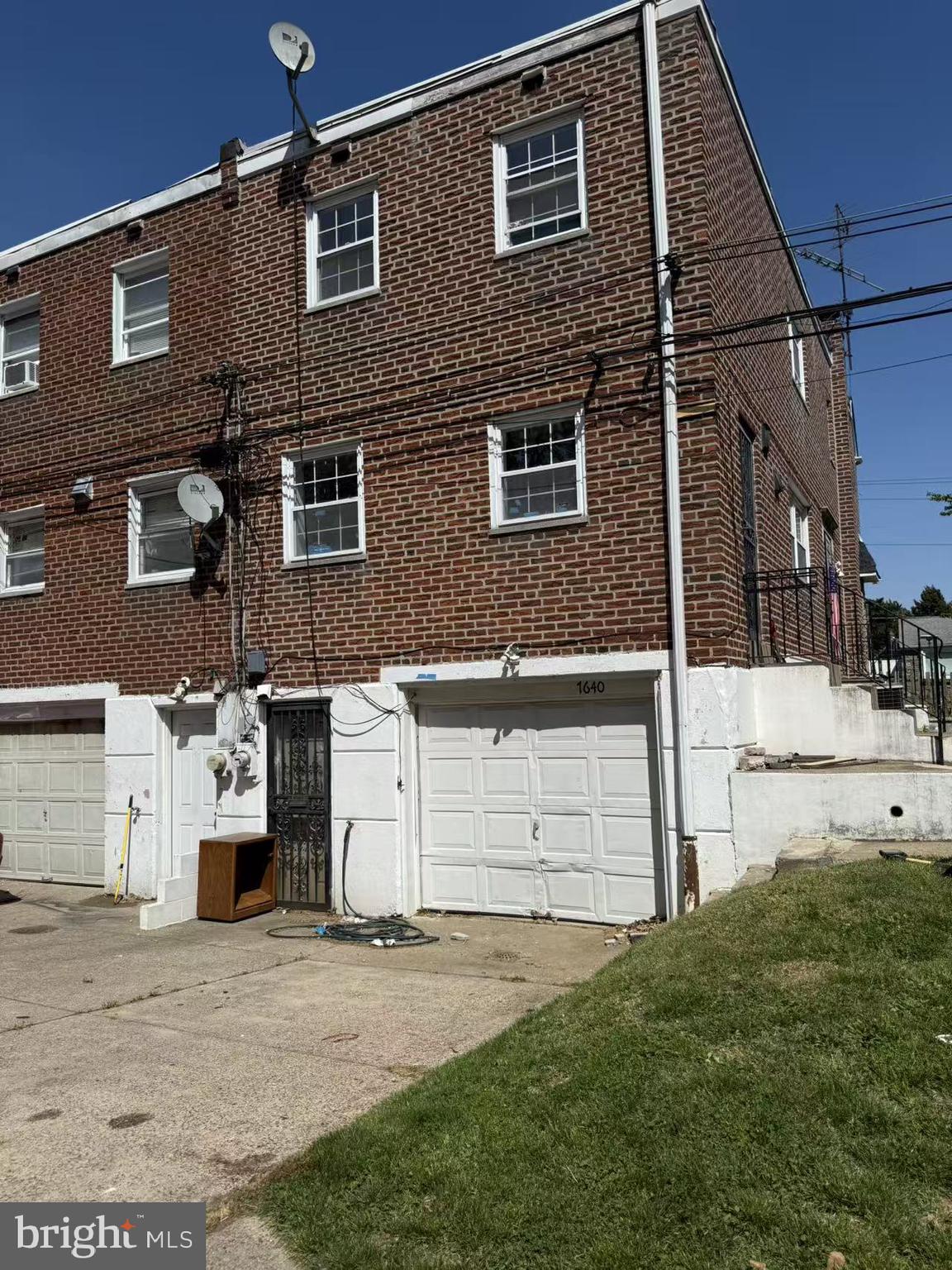 7640 Fairfield Street Philadelphia, PA 19152 - Photo 24 of 24 a front view of a house with a yard and garage