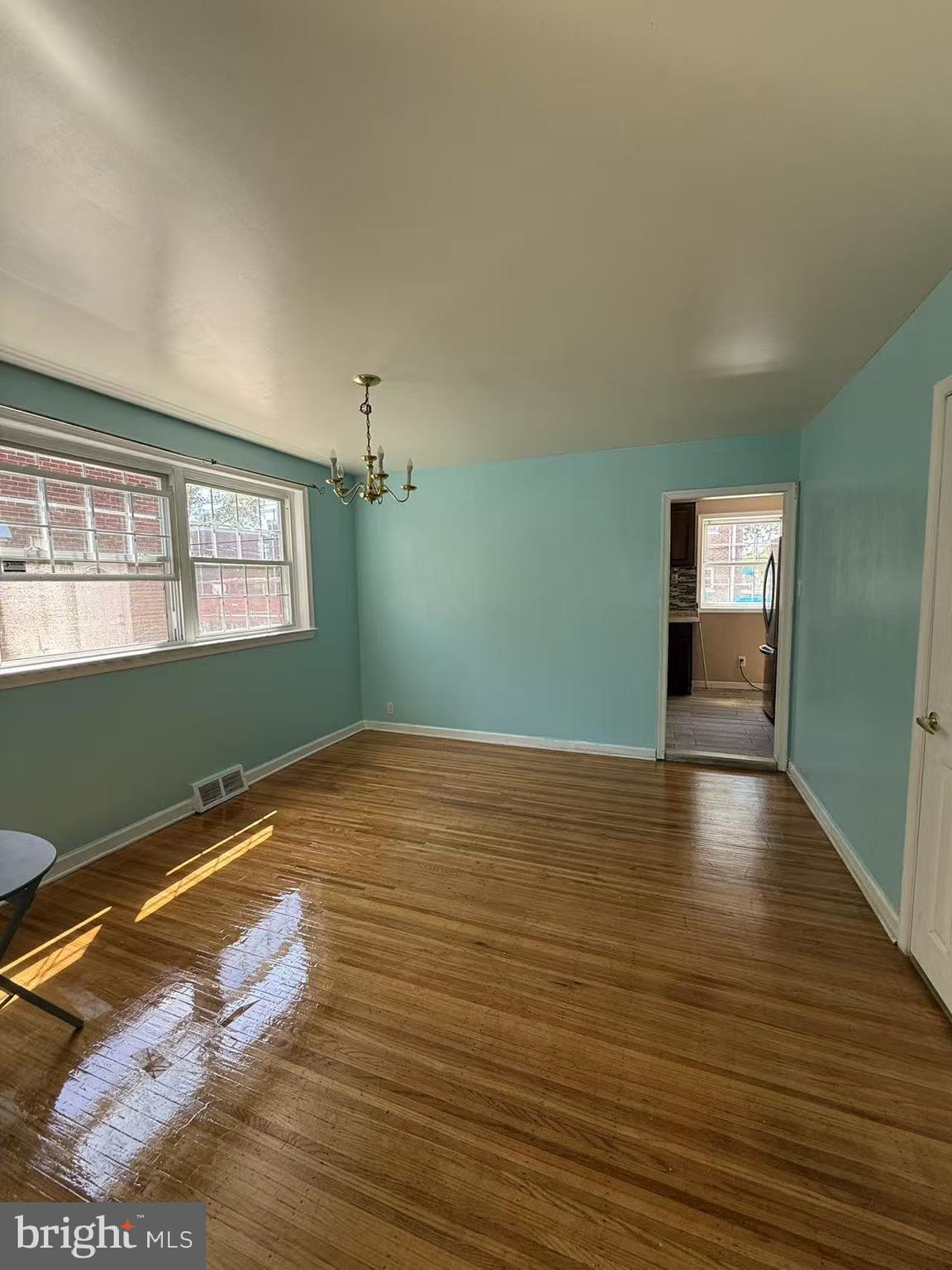 7640 Fairfield Street Philadelphia, PA 19152 - Photo 7 of 24 a view of empty room with window and wooden floor