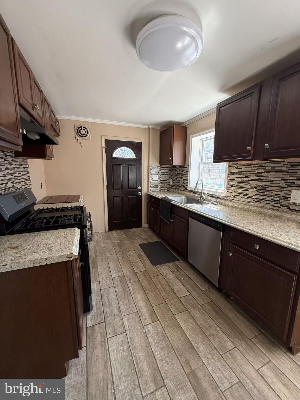 7640 Fairfield Street Philadelphia, PA 19152 - Photo 9 of 24 a kitchen with stainless steel appliances granite countertop a sink stove and refrigerator