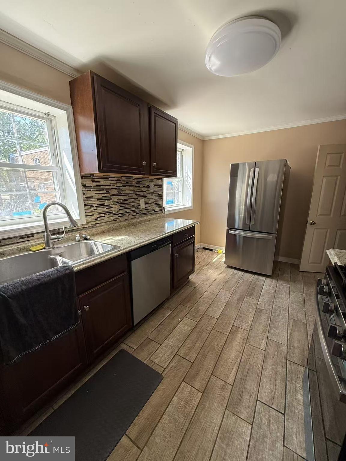 7640 Fairfield Street Philadelphia, PA 19152 - Photo 10 of 24 a kitchen with stainless steel appliances granite countertop a stove a sink and a microwave
