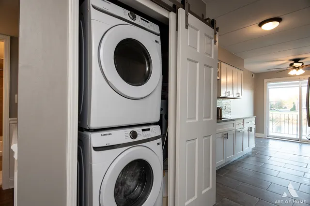 a view of a hallway with washer and dryer