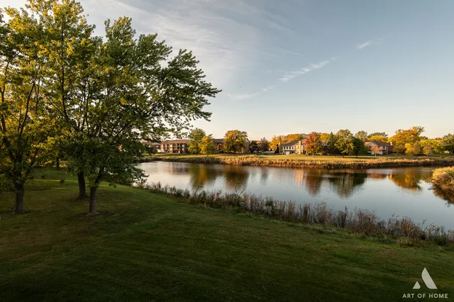 a view of a lake with a yard