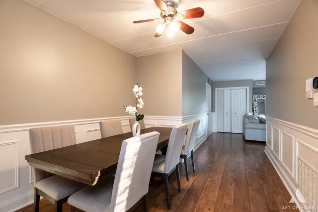 a view of a dining room with furniture and wooden floor