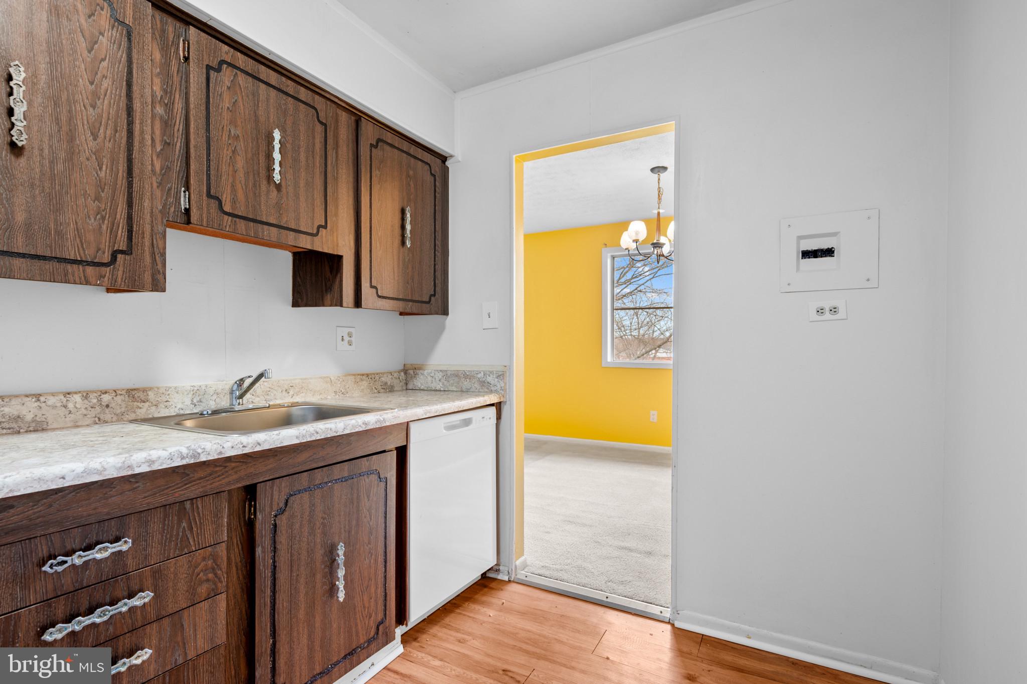 5101 8th Road South, Unit 407 Arlington, VA 22204 - Photo 8 of 26 a kitchen with stainless steel appliances granite countertop a sink and a stove next to a window