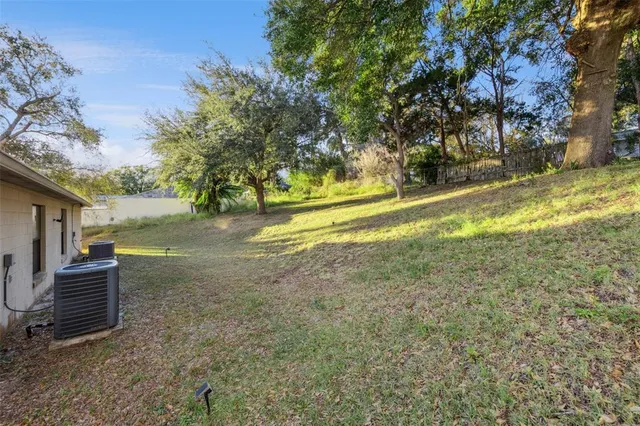 a living room with furniture and a hard wood floor