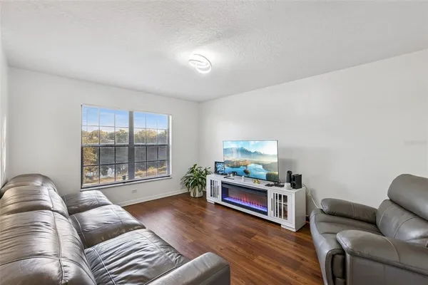 a kitchen with stainless steel appliances granite countertop a stove a sink dishwasher a refrigerator and a microwave