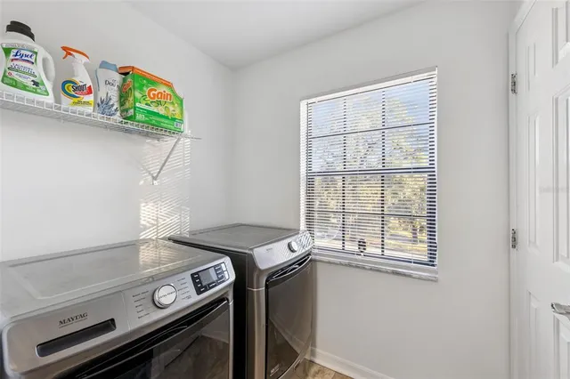 a bathroom with a shower sink vanity and mirror