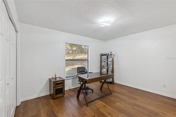 a view of a dining area with furniture and fan