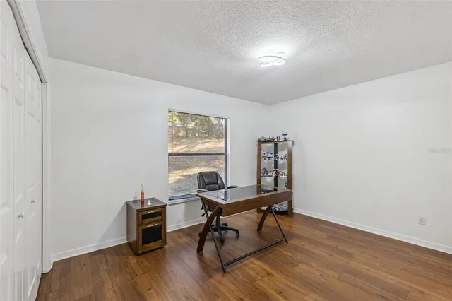 a view of a dining area with furniture and fan