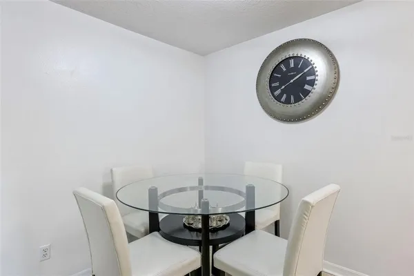 a view of a house with a backyard and a tree