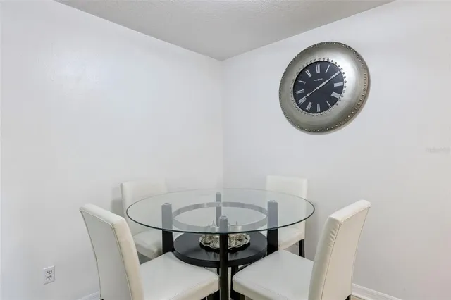 a view of a house with a backyard and a tree