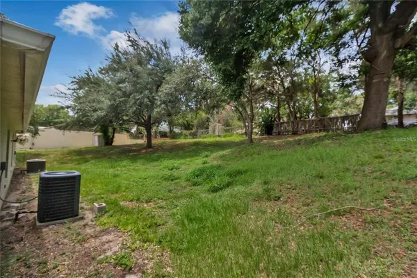a bedroom with a bed and a television