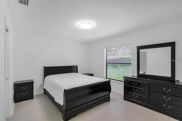 a view of kitchen with sink microwave and refrigerator