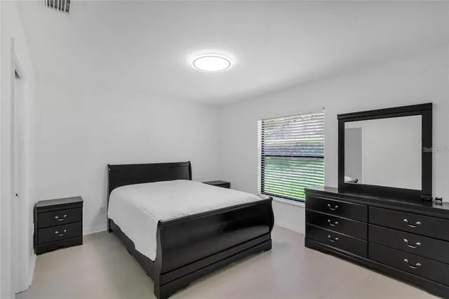 a view of kitchen with sink microwave and refrigerator