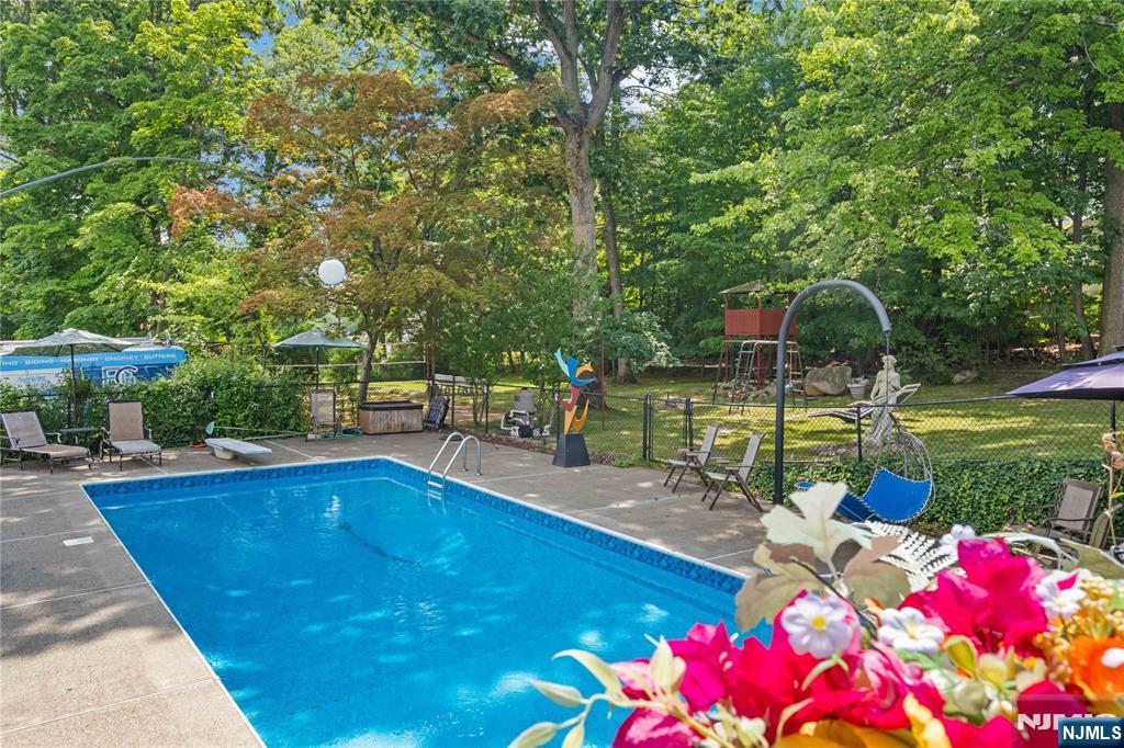 1468 Alps Road Wayne, NJ 07470 - Photo 25 of 36 a view of a swimming pool with a patio