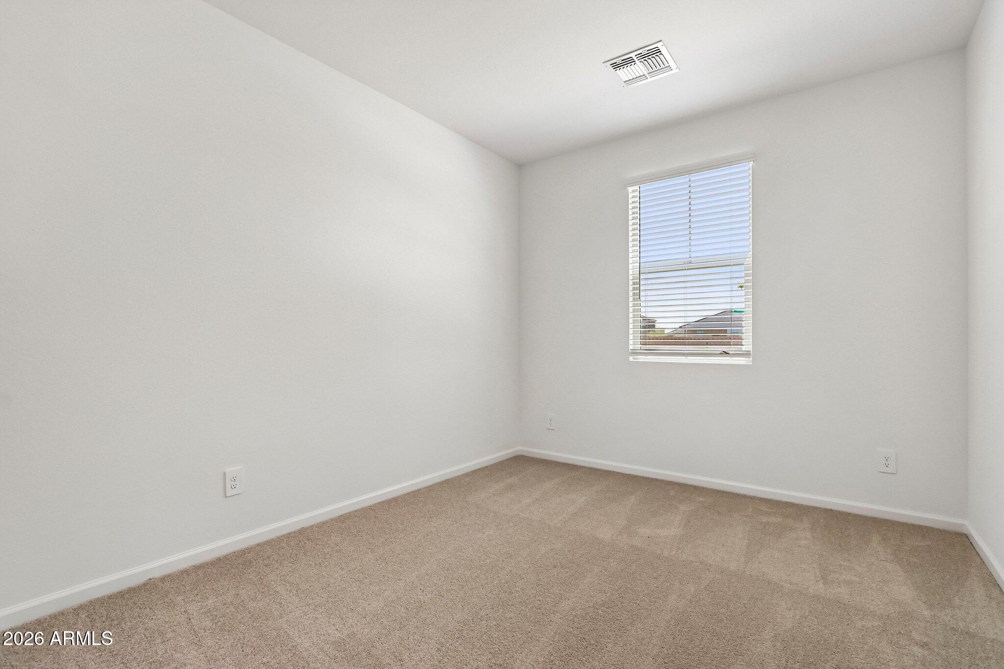 47624 West Moeller Road Maricopa, AZ 85139 - Photo 26 of 48 an empty room with windows