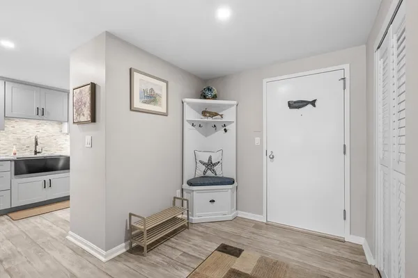 a view of a kitchen with storage and utility