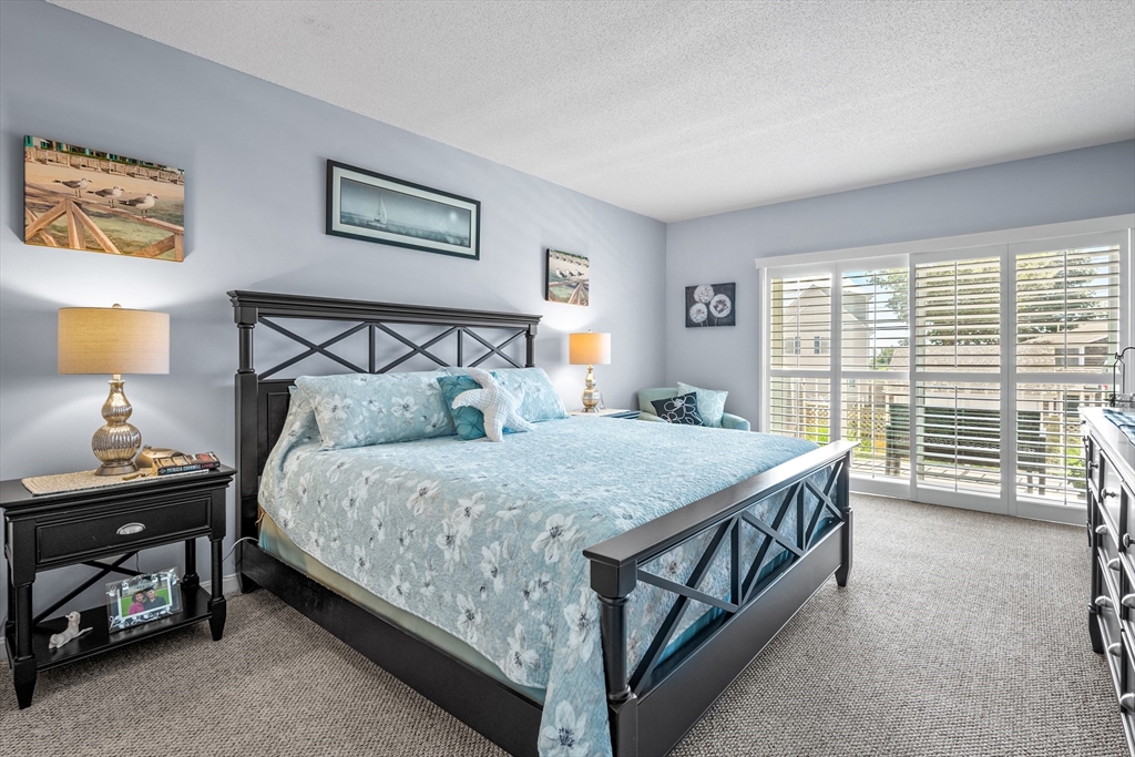 1 Belmont Road, Unit 513 West Harwich, MA 02671 - Photo 13 of 21 a bedroom with a bed and a window