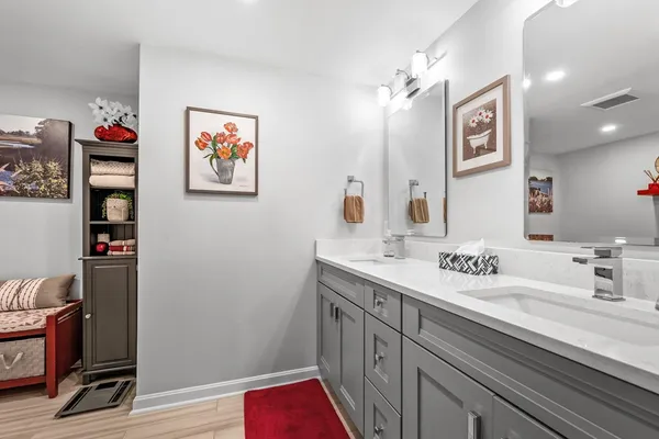 a bathroom with a sink and a mirror