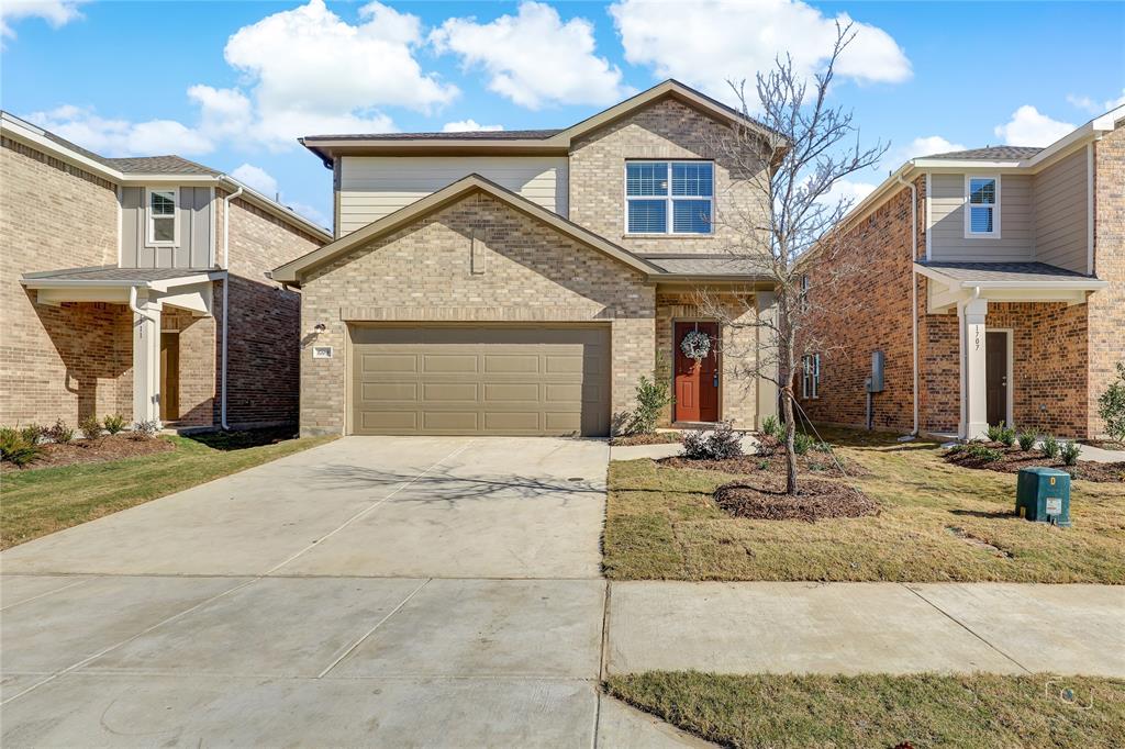 1709 Chapel Hill Road Princeton, TX 75407 - Photo 1 of 25 a front view of a house with garden