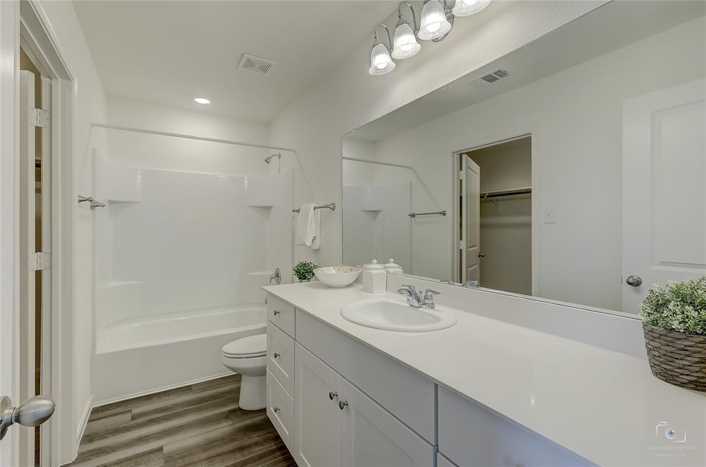 1709 Chapel Hill Road Princeton, TX 75407 - Photo 16 of 25 a bathroom with a sink a toilet and shower