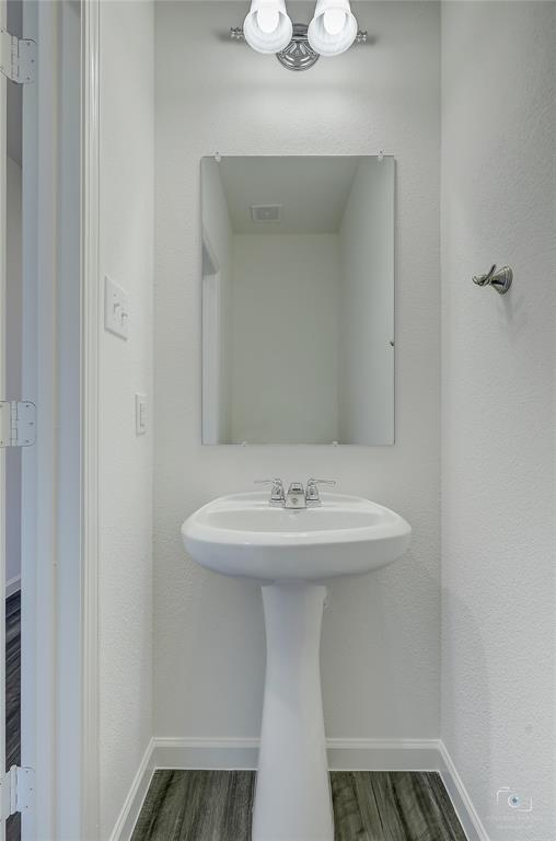 1709 Chapel Hill Road Princeton, TX 75407 - Photo 22 of 25 a bathroom with a sink and a mirror