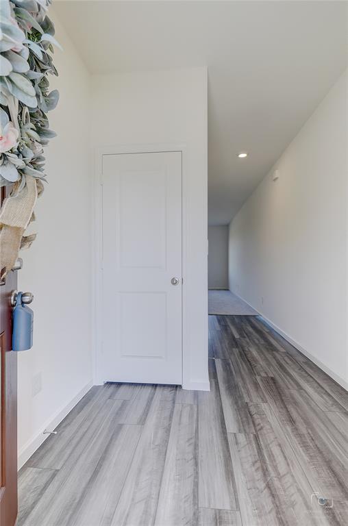 1709 Chapel Hill Road Princeton, TX 75407 - Photo 4 of 25 a view of a room with wooden floor and bench