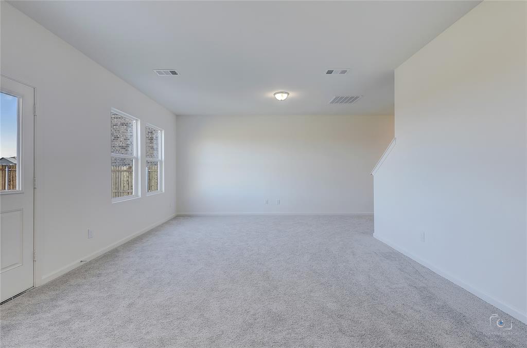 1709 Chapel Hill Road Princeton, TX 75407 - Photo 7 of 25 a view of an empty room with a window
