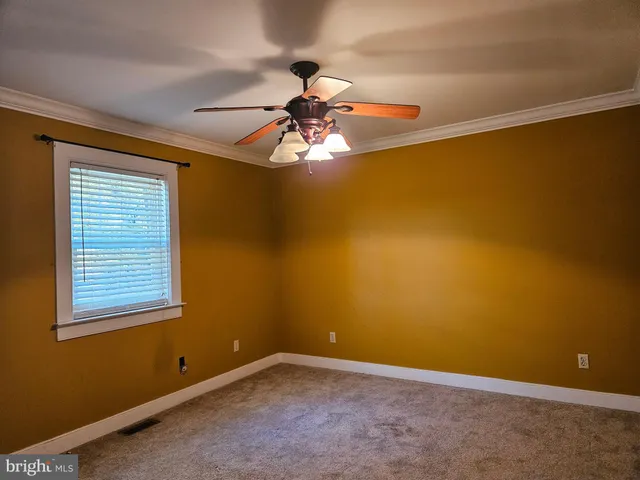 a view of backyard with a deck and wooden floor