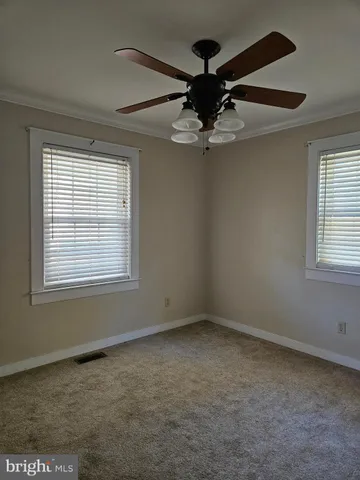 a view of porch with wooden floor