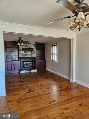 a view of a livingroom with furniture nad wooden floor