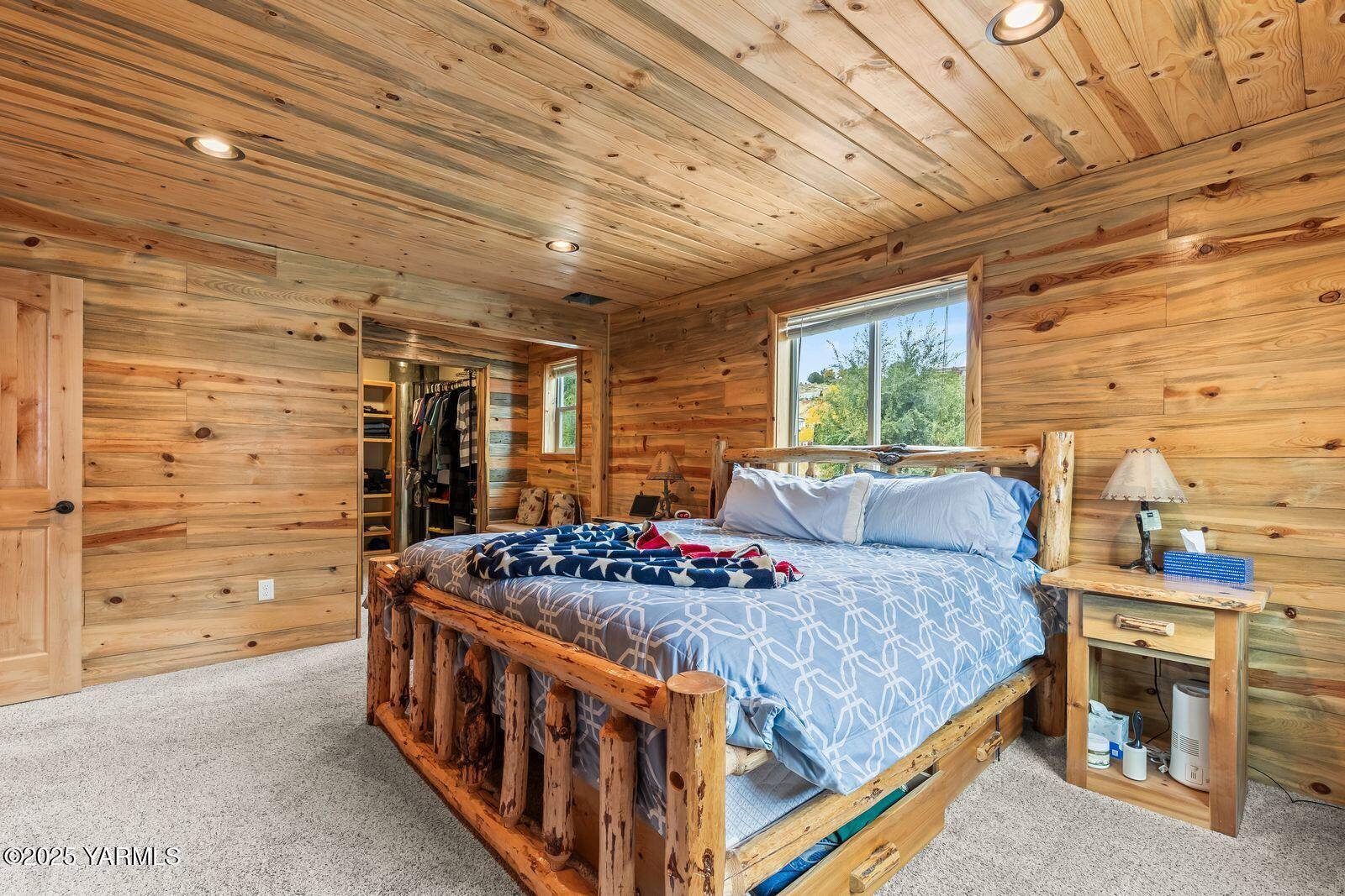 233 Tibbling Road Selah, WA 98942 - Photo 13 of 51 a bedroom with a bed next to a window