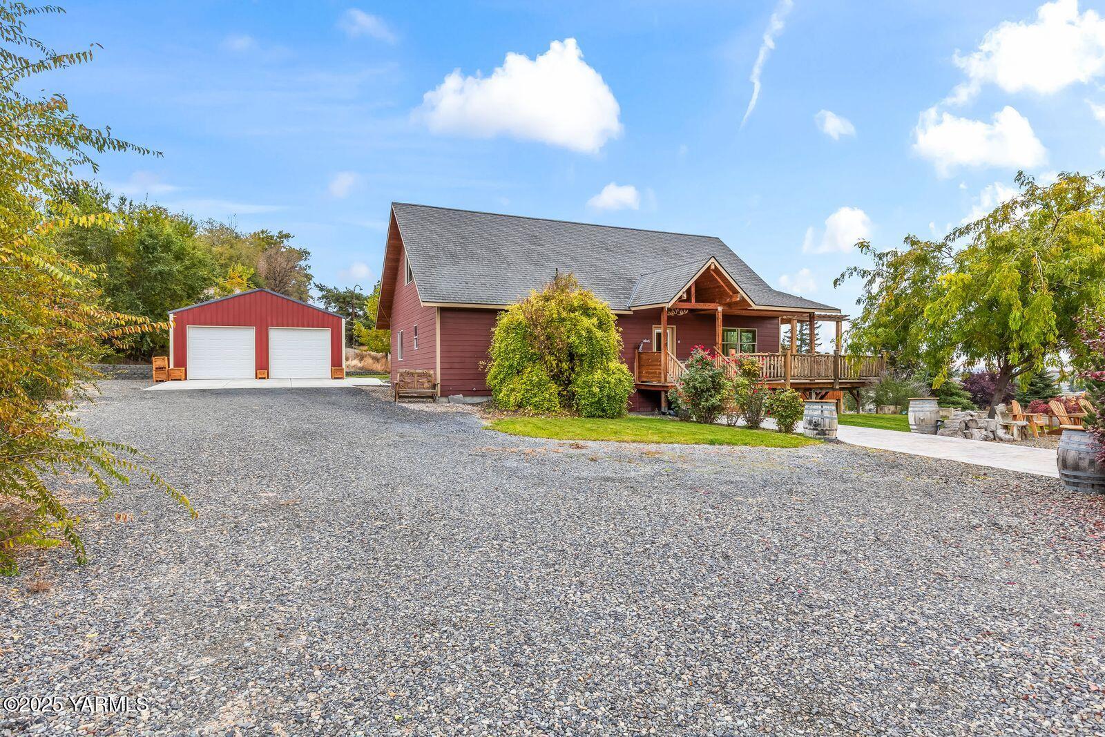 233 Tibbling Road Selah, WA 98942 - Photo 2 of 51 a view of a house with a yard and large tree