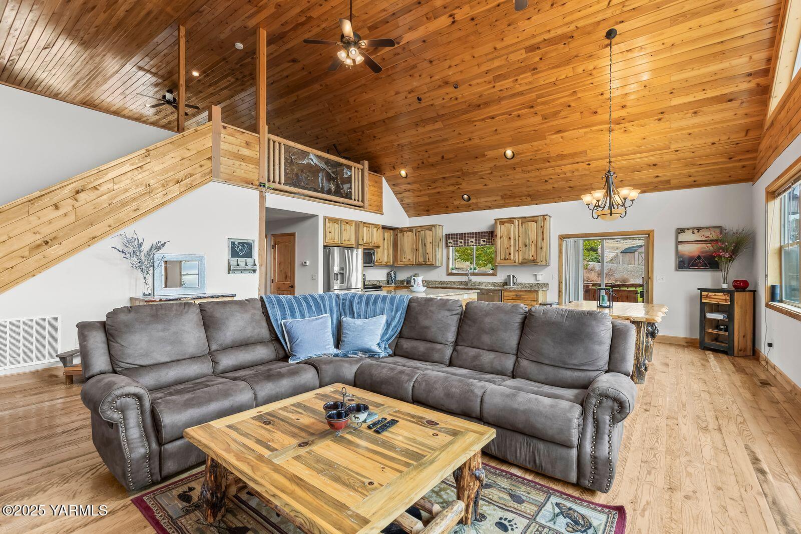 233 Tibbling Road Selah, WA 98942 - Photo 7 of 51 a living room with furniture a ceiling fan and a rug