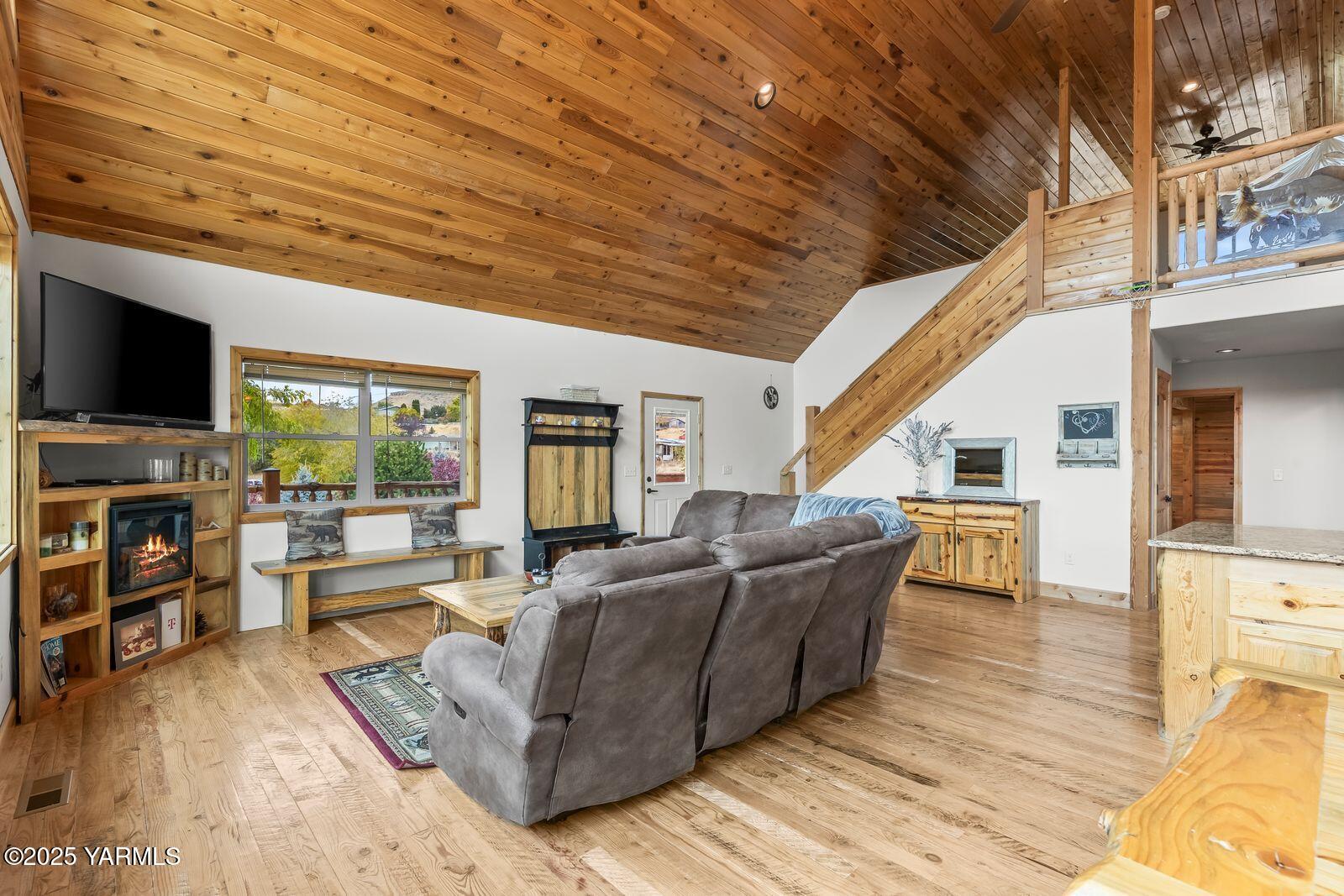 233 Tibbling Road Selah, WA 98942 - Photo 8 of 51 a living room with furniture and a flat screen tv