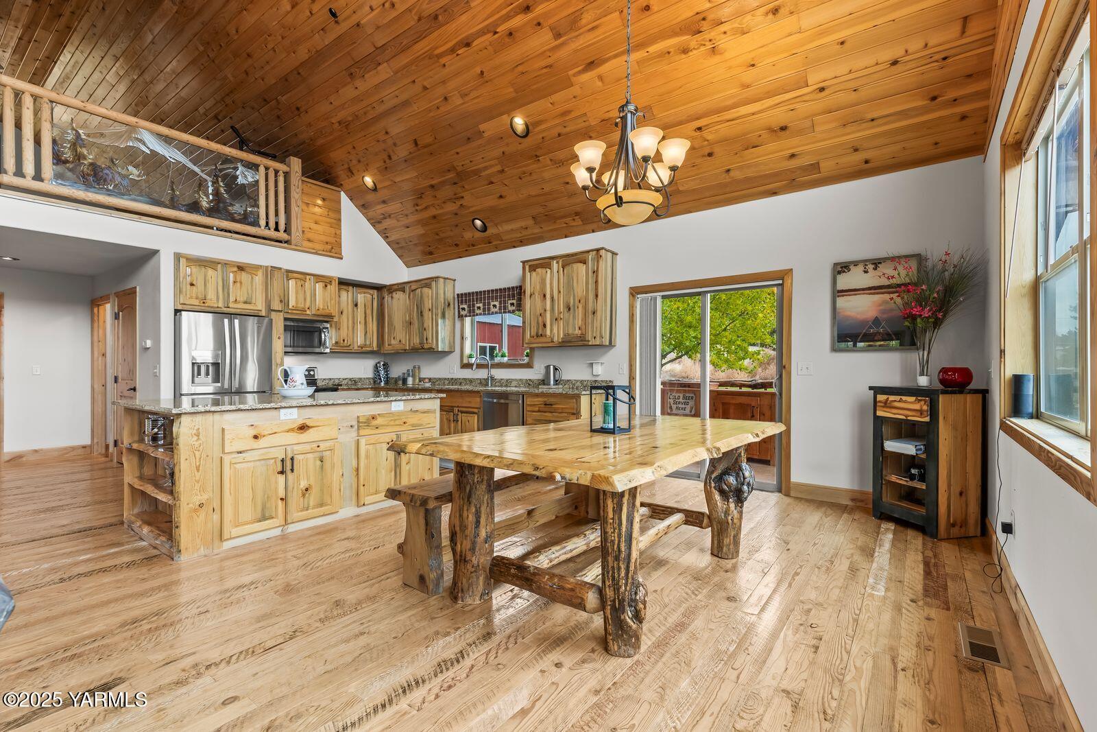 233 Tibbling Road Selah, WA 98942 - Photo 10 of 51 a living room with stainless steel appliances kitchen island granite countertop furniture and a kitchen view