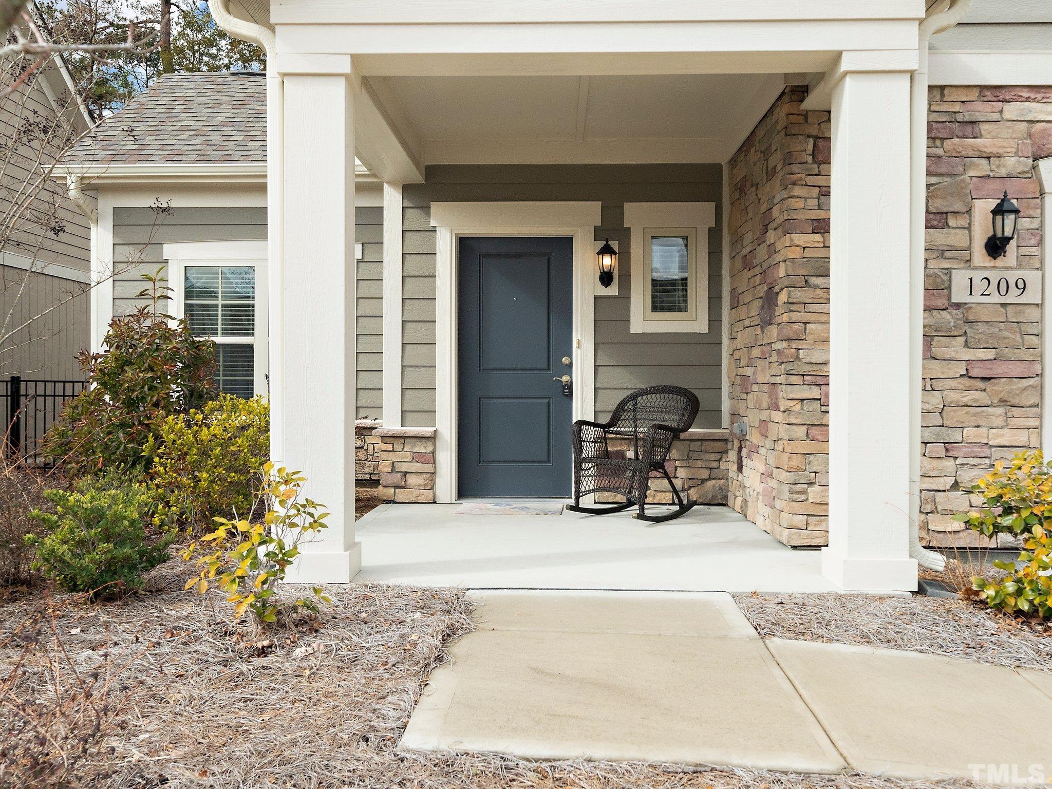 1209 Provision Place Wake Forest, NC 27587 - Photo 3 of 22 a view of a chair and fire pit in front of a house