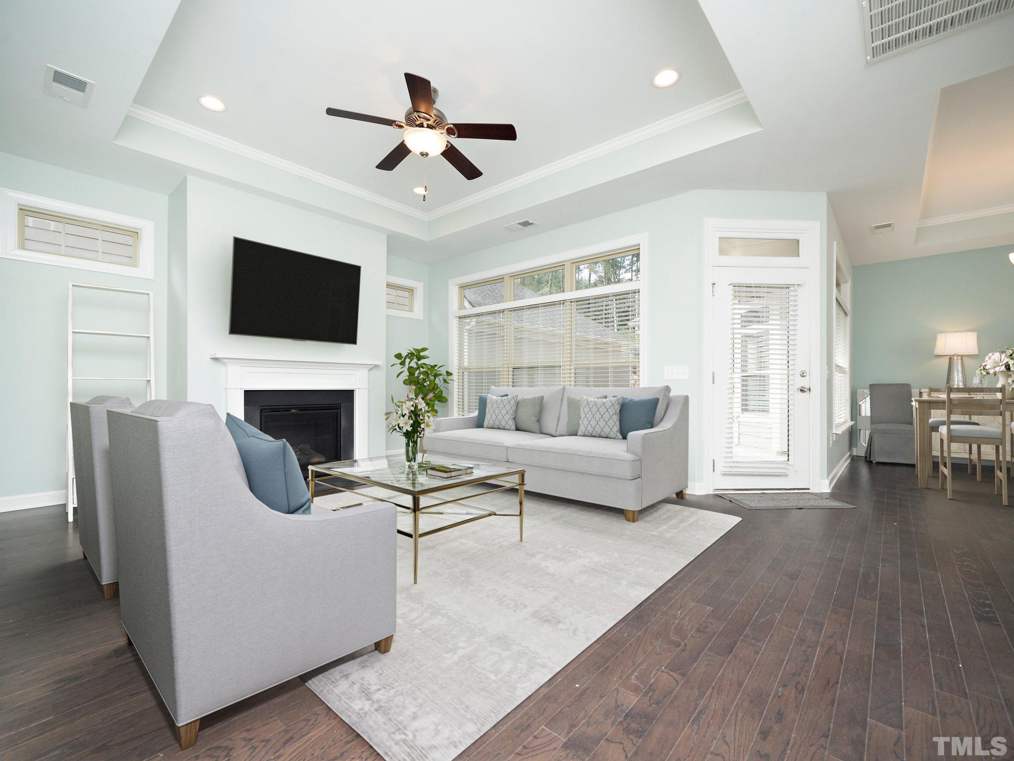 1209 Provision Place Wake Forest, NC 27587 - Photo 5 of 22 a living room with furniture a fireplace and a flat screen tv