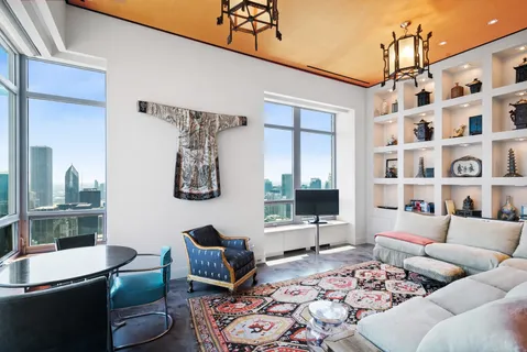 a bedroom with a large bed and a large window