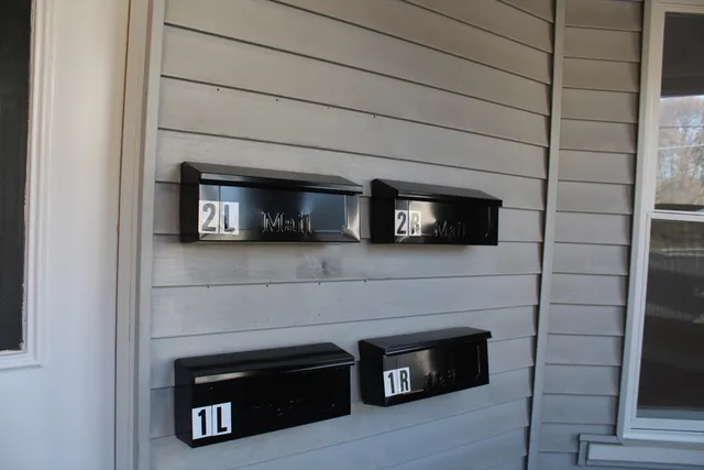 a living room with a fireplace and a flat screen tv