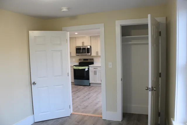 a kitchen with a refrigerator and a stove
