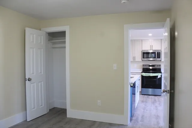 a view of kitchen and wooden floor