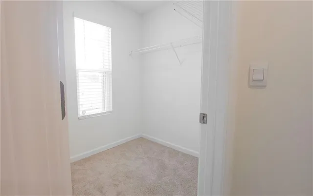 a view of a bathroom from a hallway