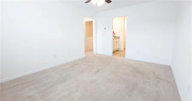 a bathroom with a sink vanity mirror and toilet