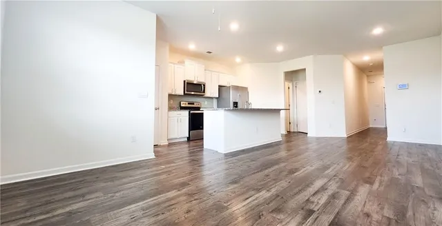 a view of kitchen with wooden floor