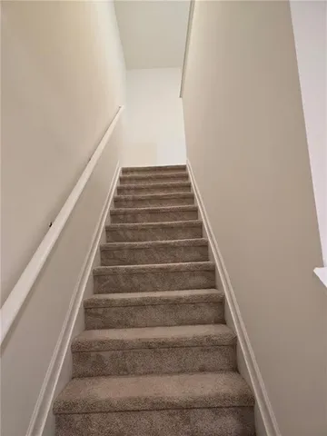 a view of a hallway with white walls