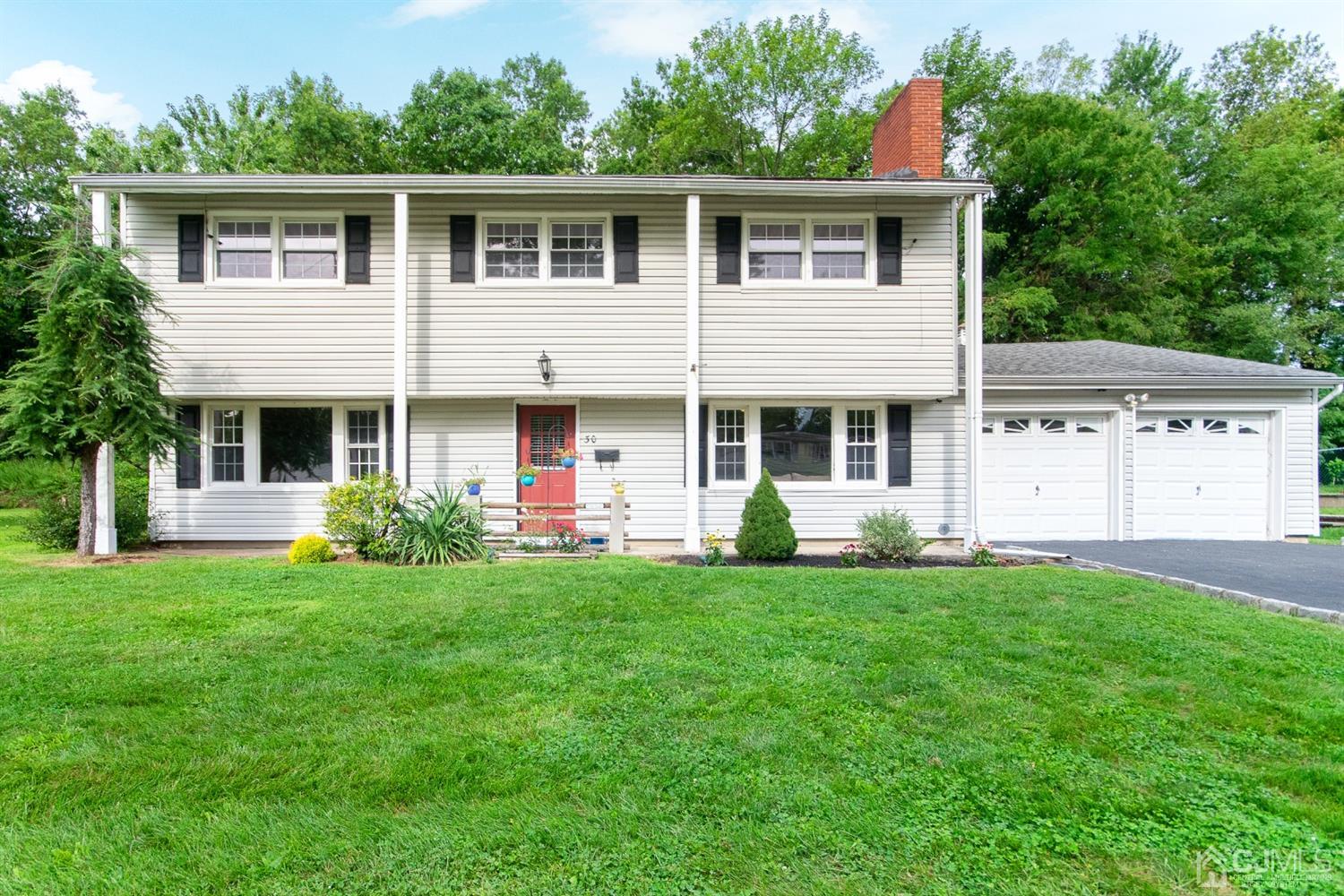 30 Wilk Road Edison, NJ 08837 - Photo 2 of 35 a front view of a house with a garden