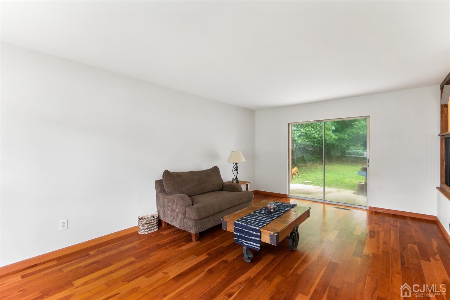 30 Wilk Road Edison, NJ 08837 - Photo 16 of 35 a living room with furniture and a wooden floor